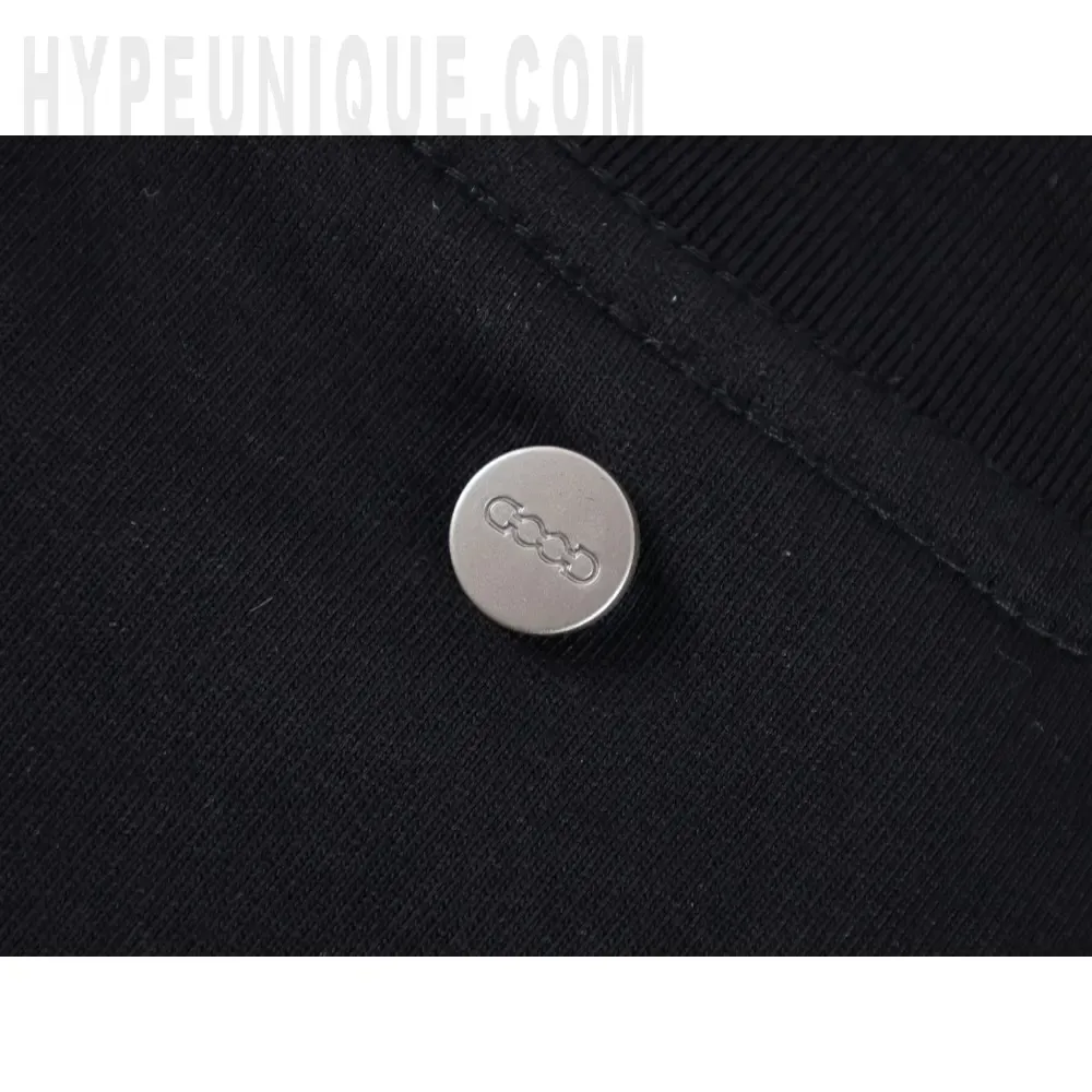 Close-up of button detail on the clothes