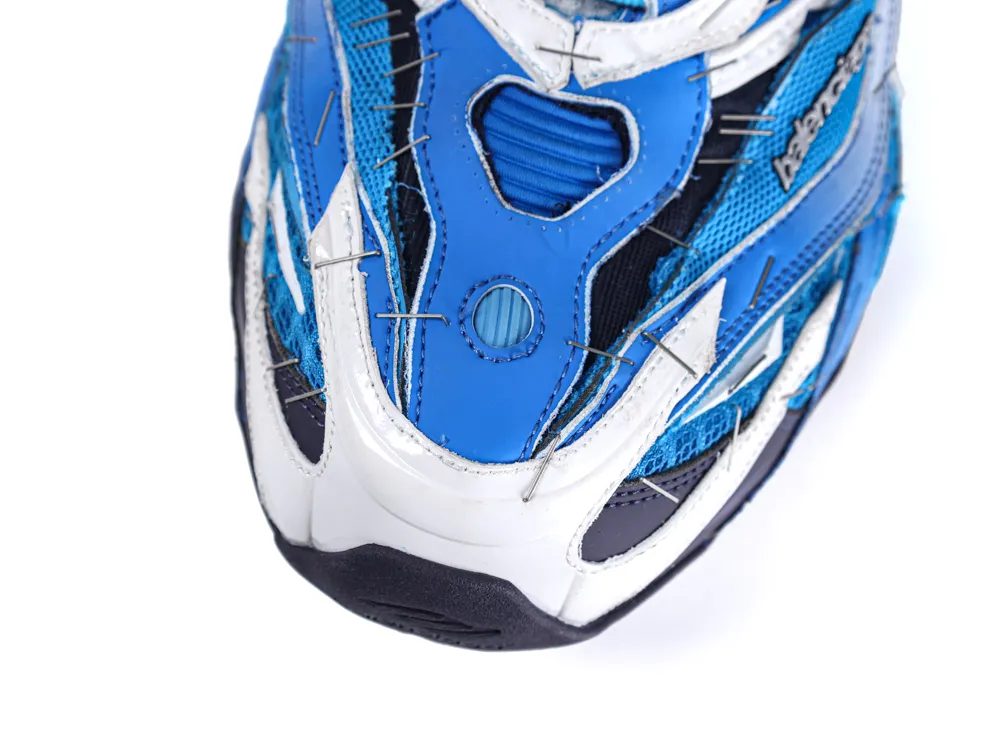 Blue and white sneaker toe made of synthetic material with mesh detailing.