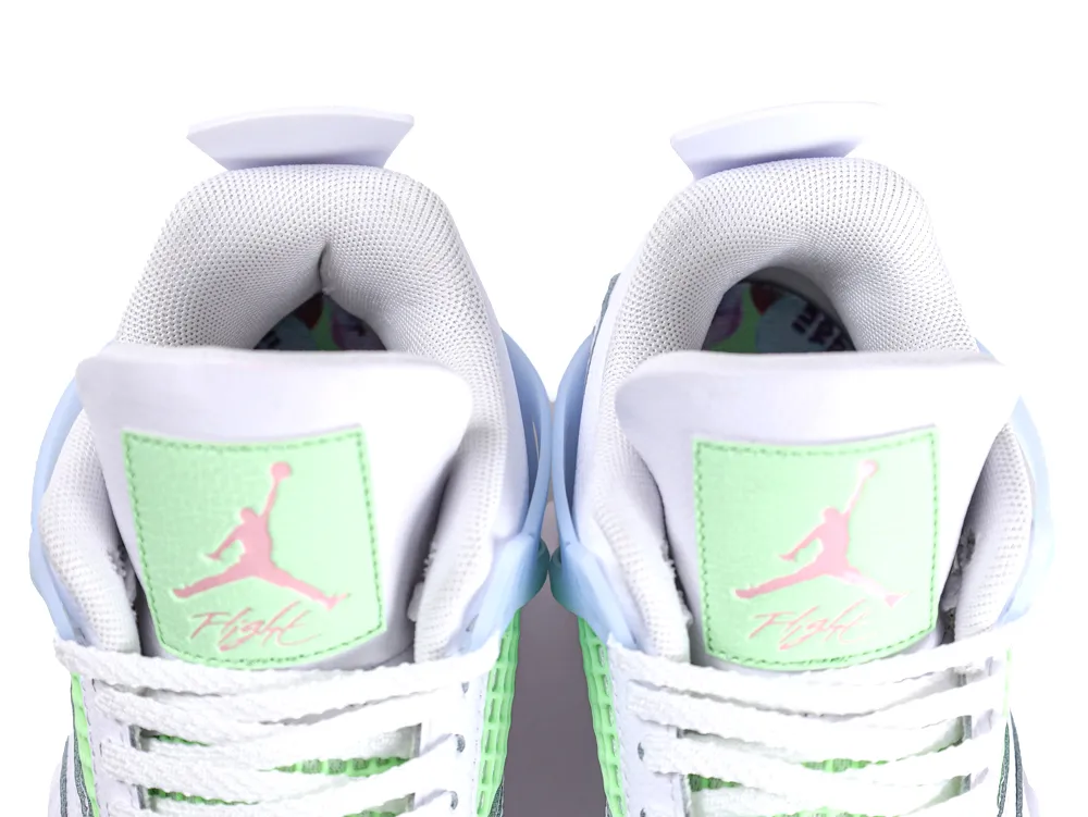 Top-down view of both Jordan 4 tongues showing the mint green logo patches and white laces.