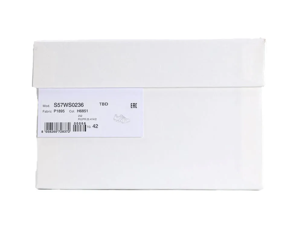 White cardboard shoe box with label displaying product details and barcode.