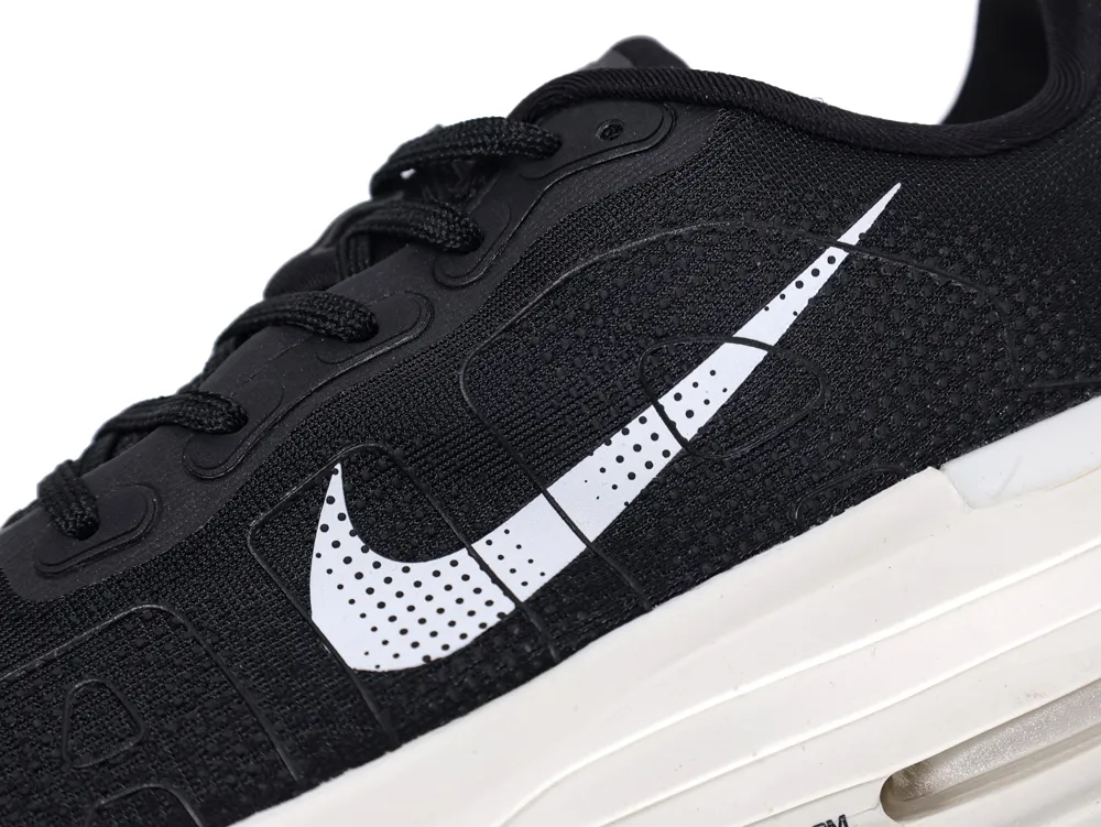 Black mesh sneaker with a white rubber sole and contrasting logo detail.