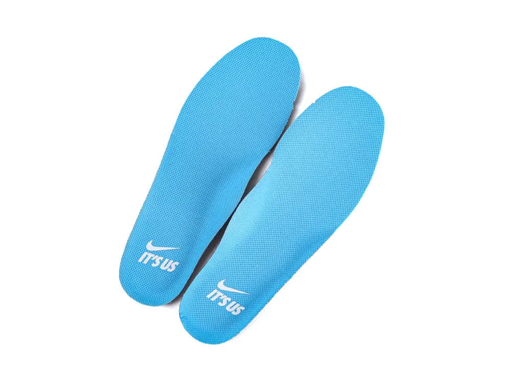 Bright blue fabric insoles featuring a textured design with logo print.