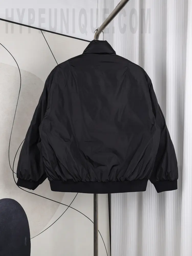 Back view of the PRD Metal Triangle Logo Nylon Down Jacket, showcasing the all-black design and nylon fabric construction.