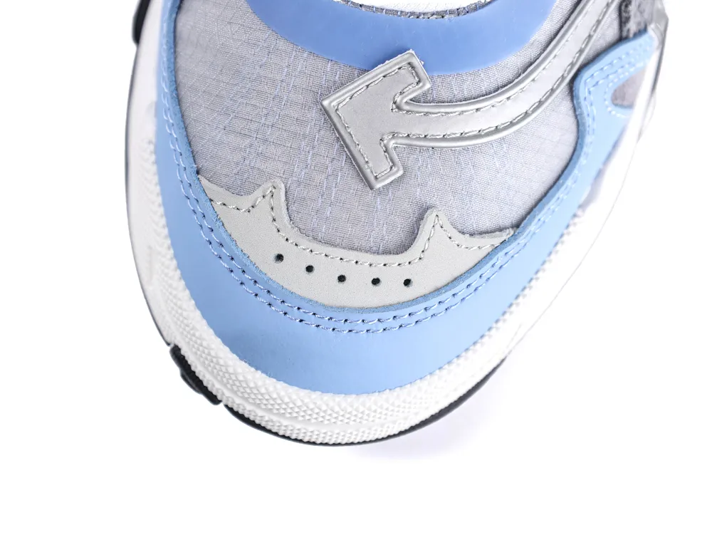 Blue, grey, and white sneaker with textured fabric and leather detailing on the toe.