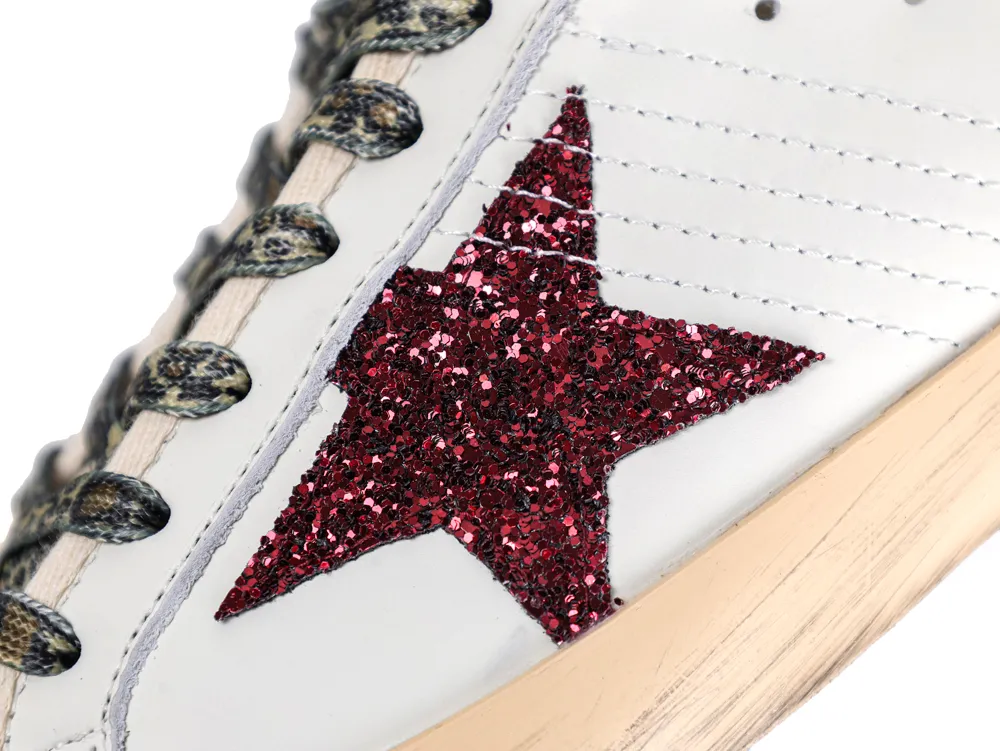 Burgundy glitter star and leopard print laces on Golden Goose sneake